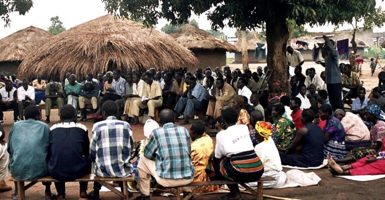 Meeting of people in village in uganda africa